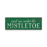 a green sign that says meet me under the mistletoe