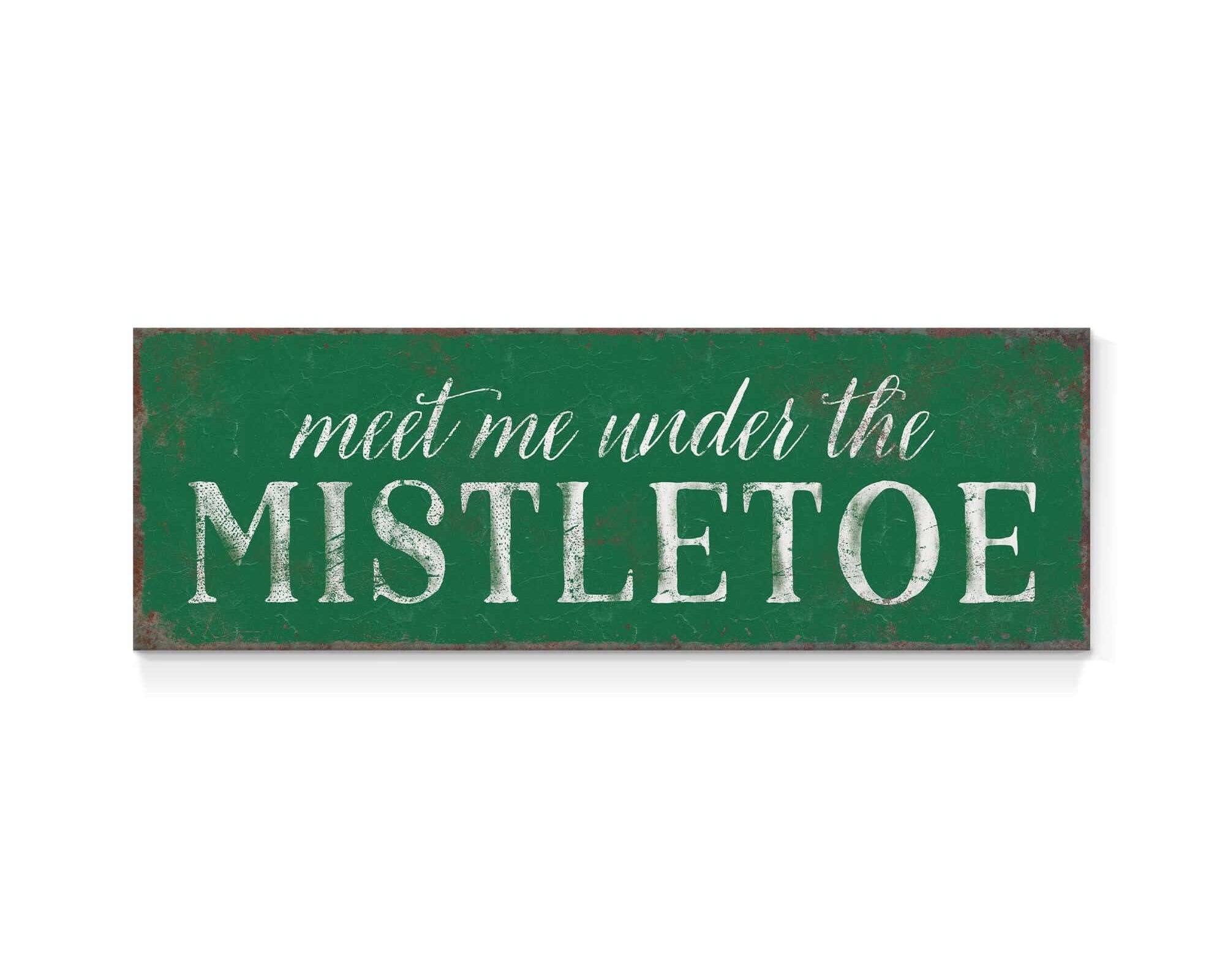 a green sign that says meet me under the mistletoe