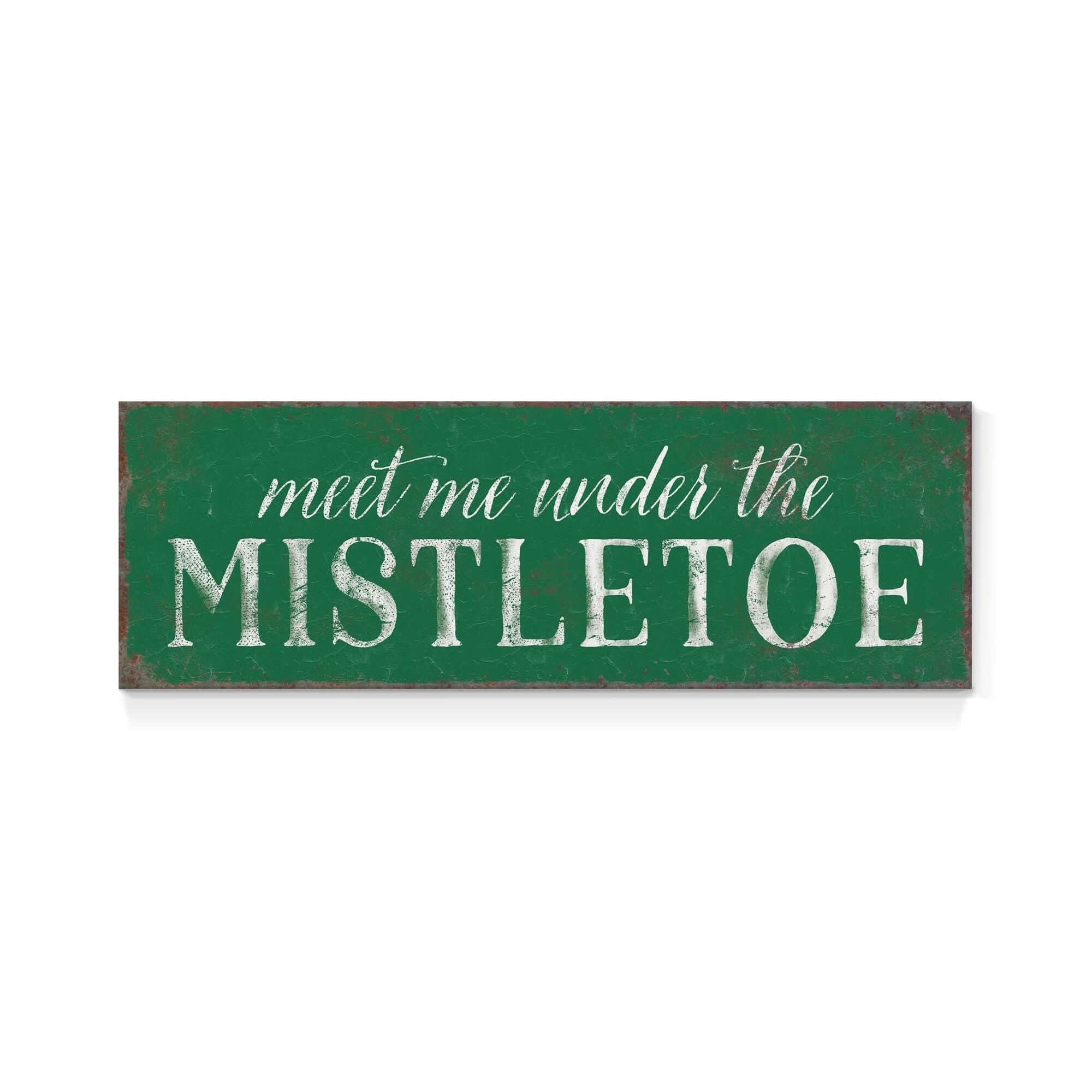a green sign that says meet me under the mistletoe