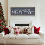 a white couch sitting in a living room next to a christmas tree