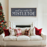 a white couch sitting in a living room next to a christmas tree