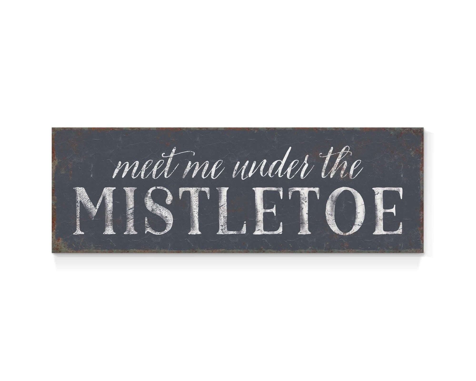 a sign that says meet me under the mistletoe