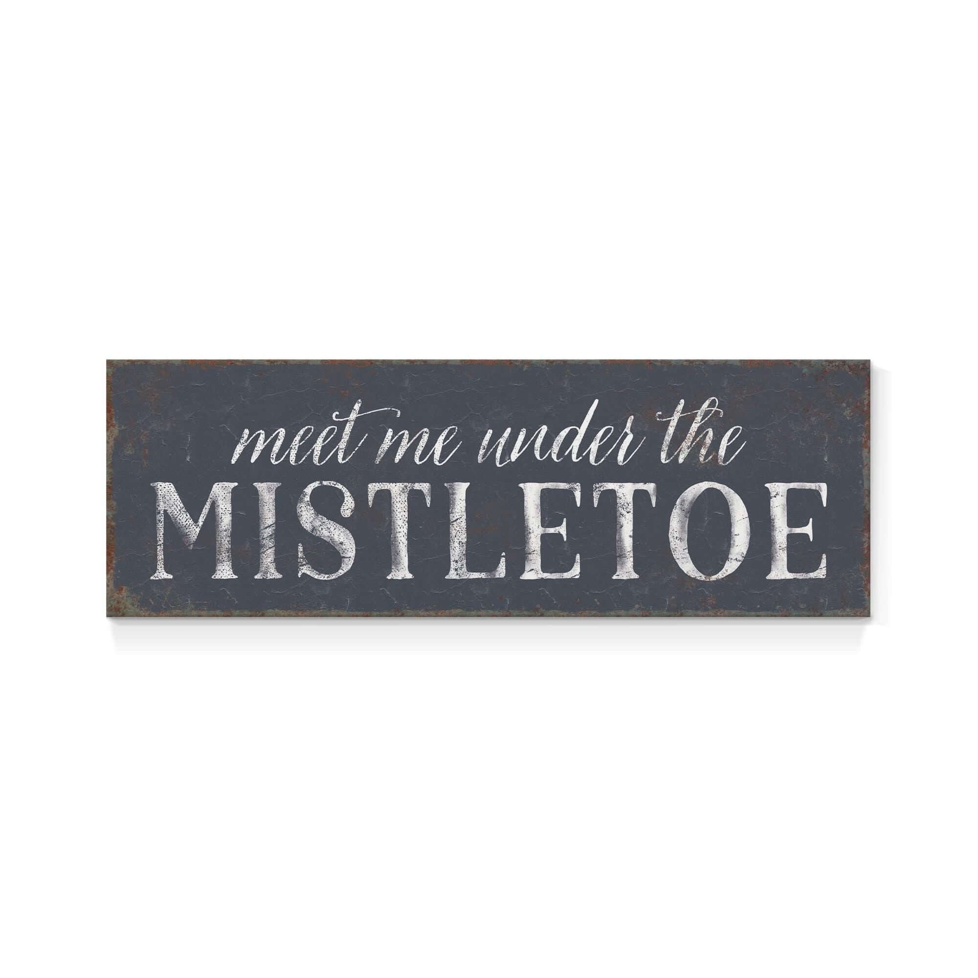 a sign that says meet me under the mistletoe