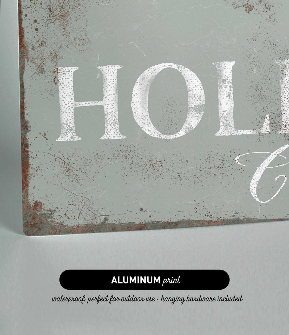 a metal sign that says holla on it