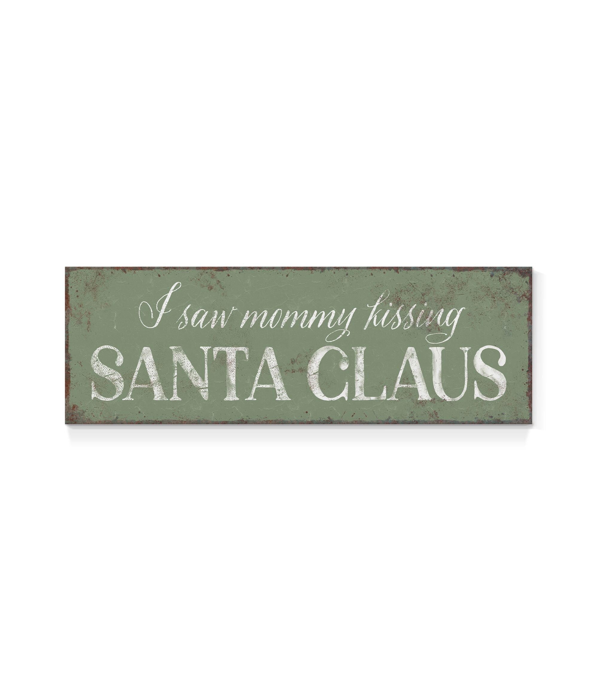 a sign that says i saw mommy kissing santa claus