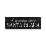 a sign that says i saw mommy kissing santa claus