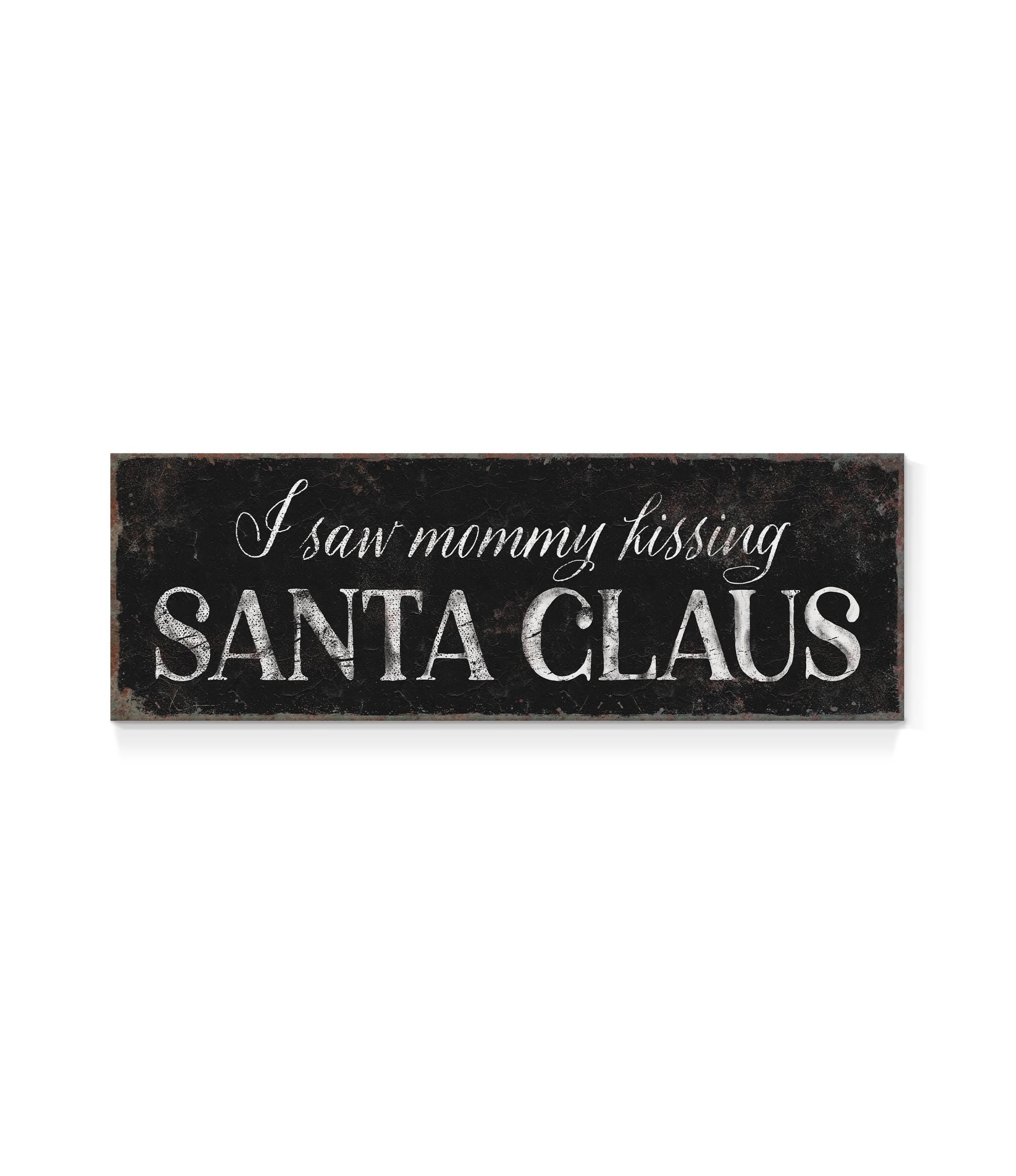 a sign that says i saw mommy kissing santa claus