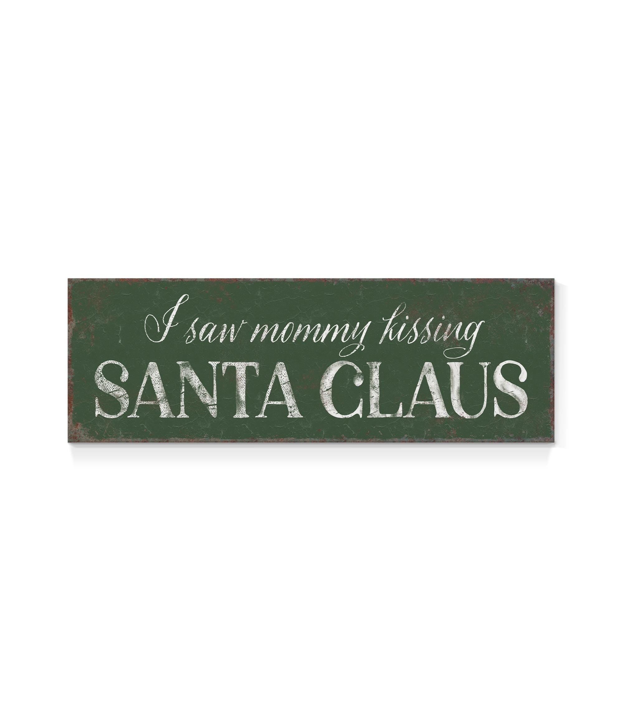 a sign that says i saw mommy kissing santa claus