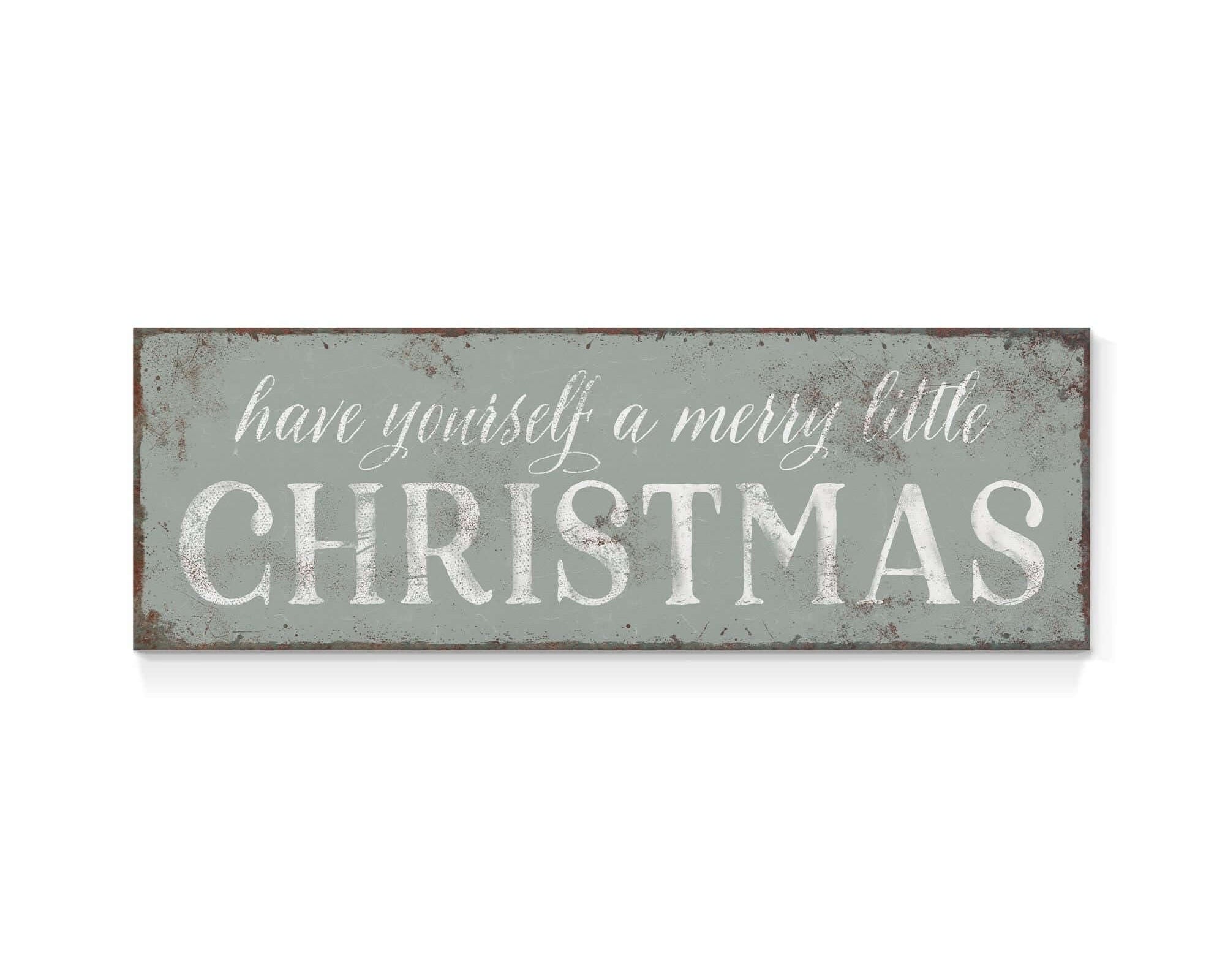 a metal sign that says have yourself a merry little christmas