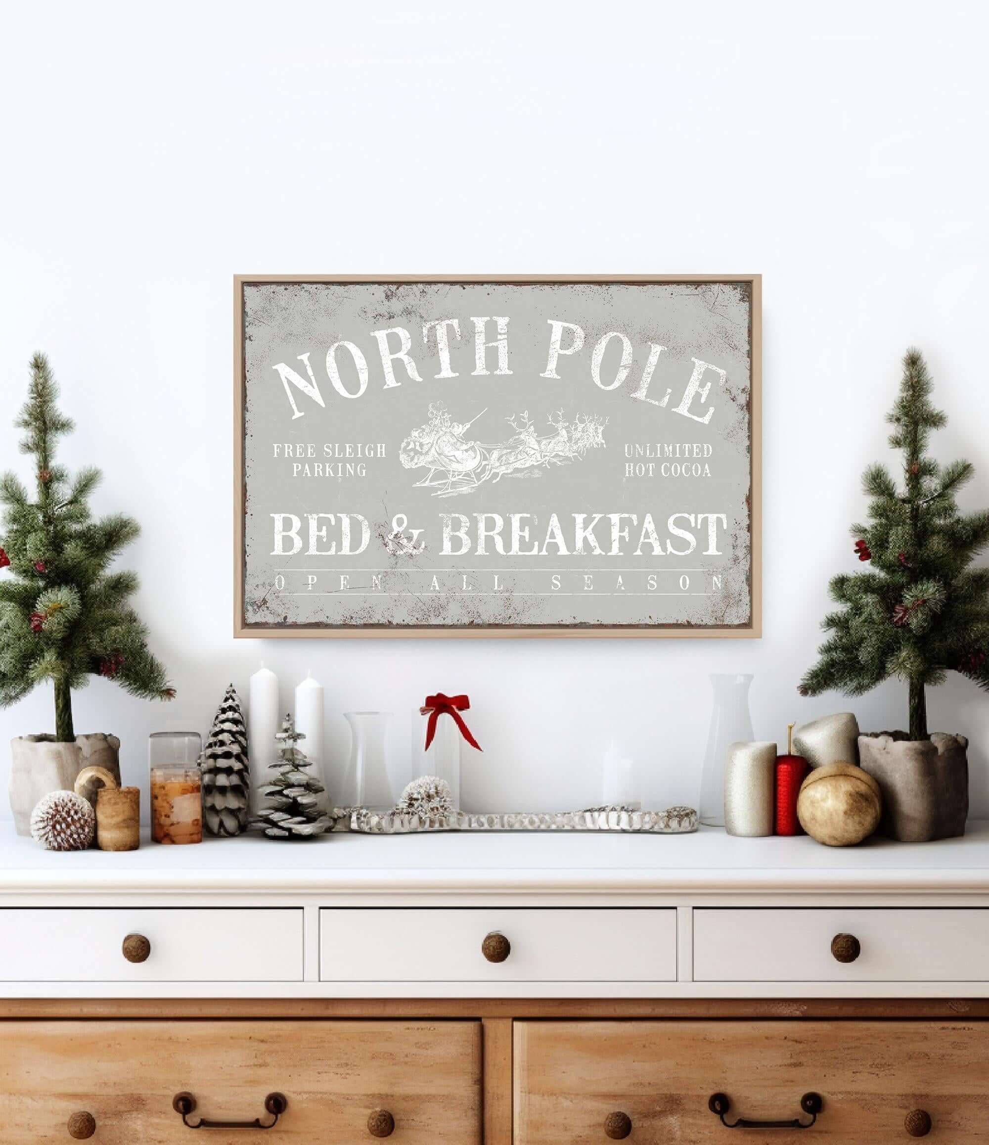 a christmas scene with a bed and breakfast sign