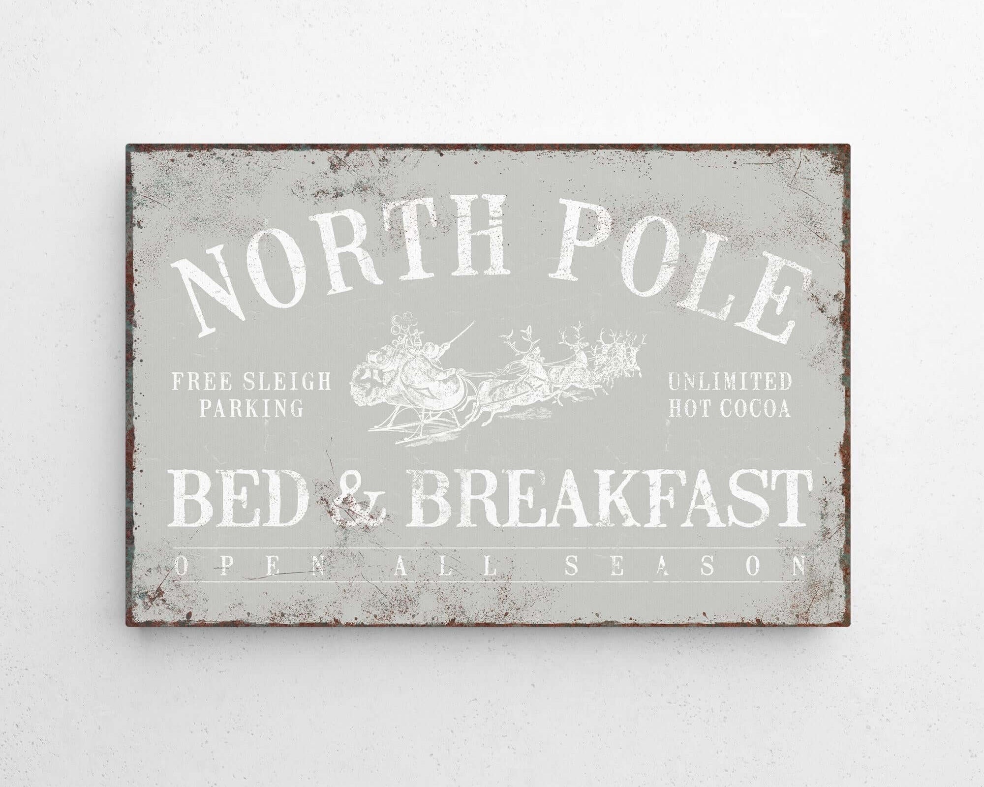 a metal sign that says north pole bed and breakfast