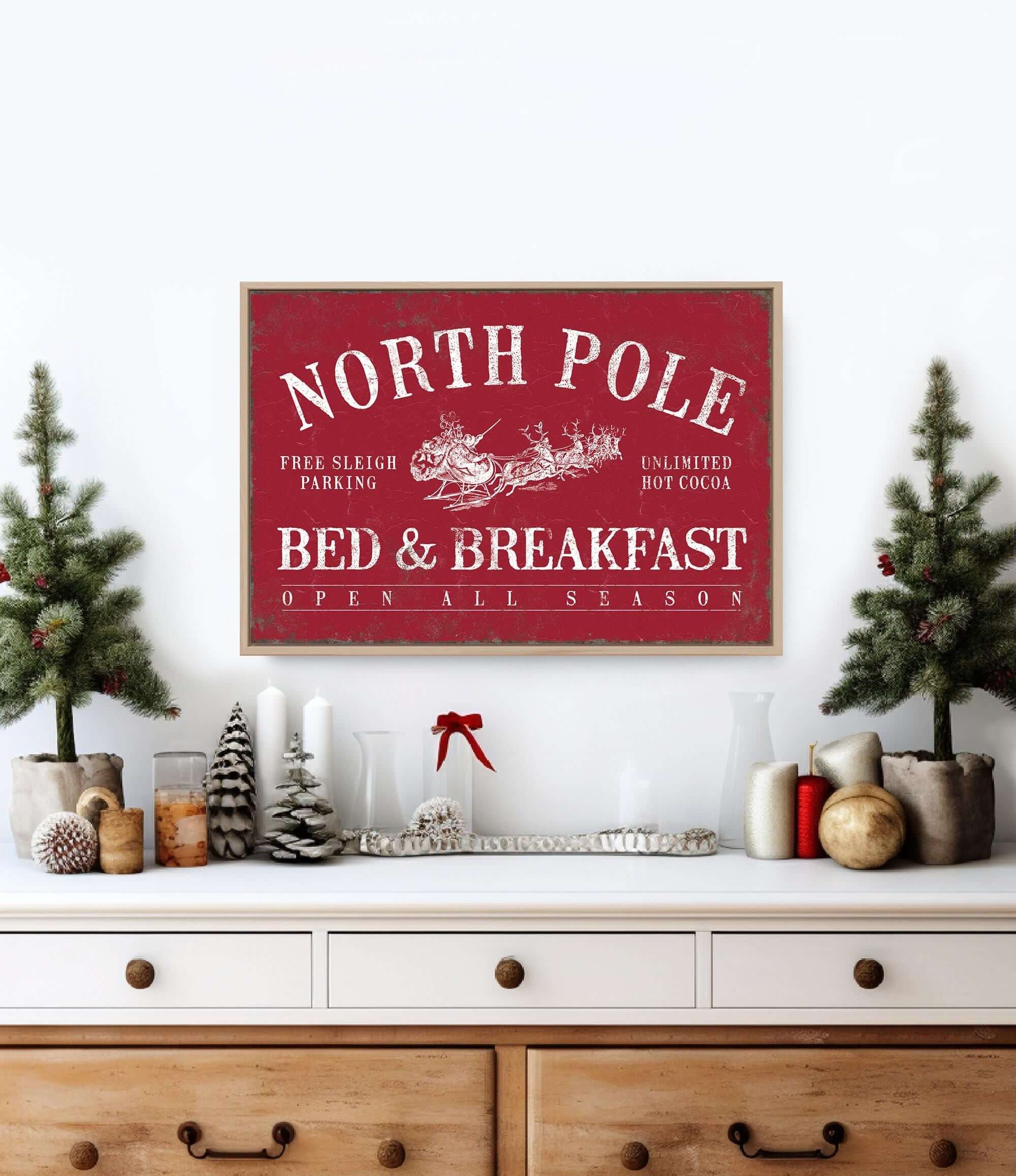 a christmas scene with a bed and breakfast sign