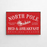 a red sign that says north pole bed and breakfast