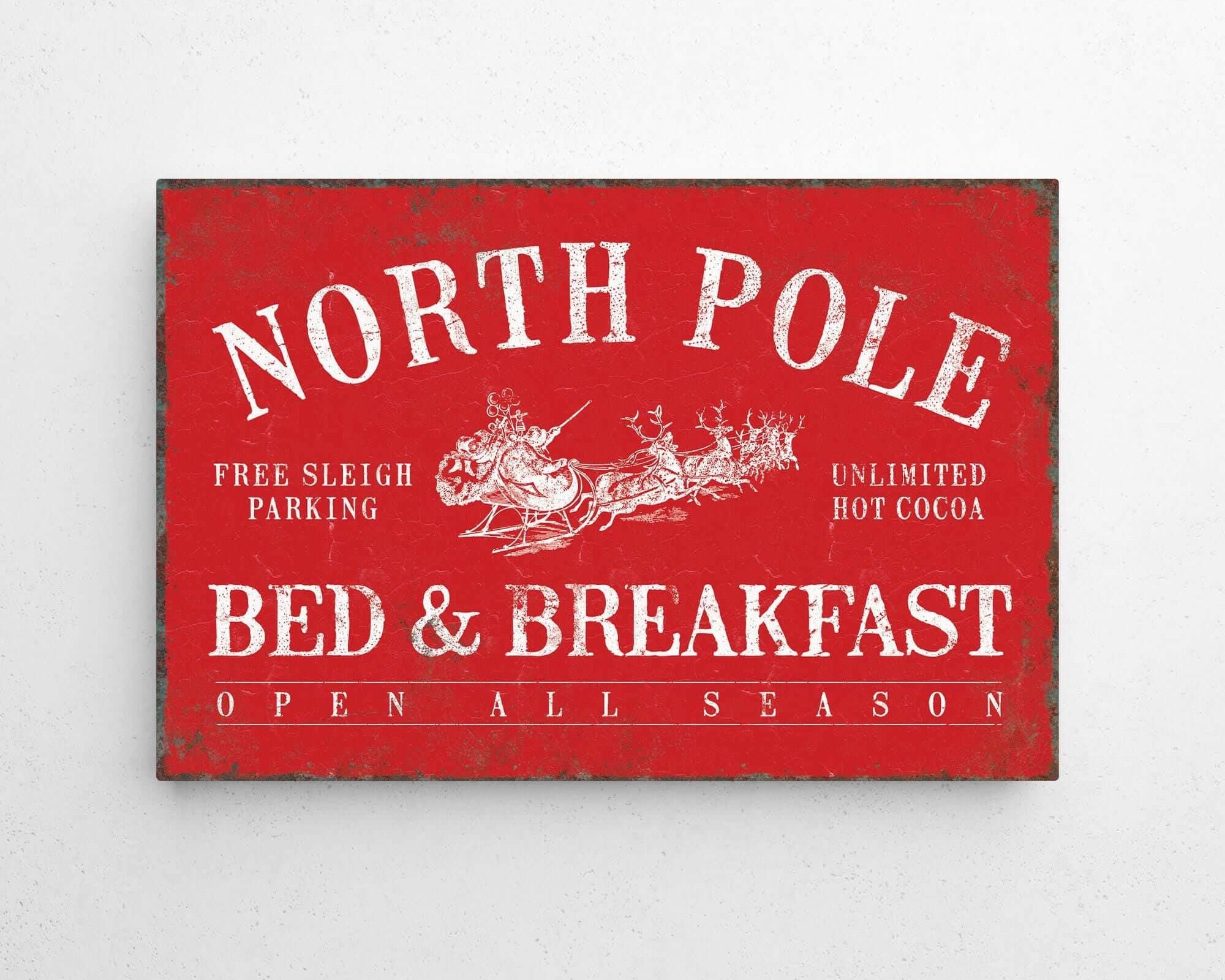 a red sign that says north pole bed and breakfast