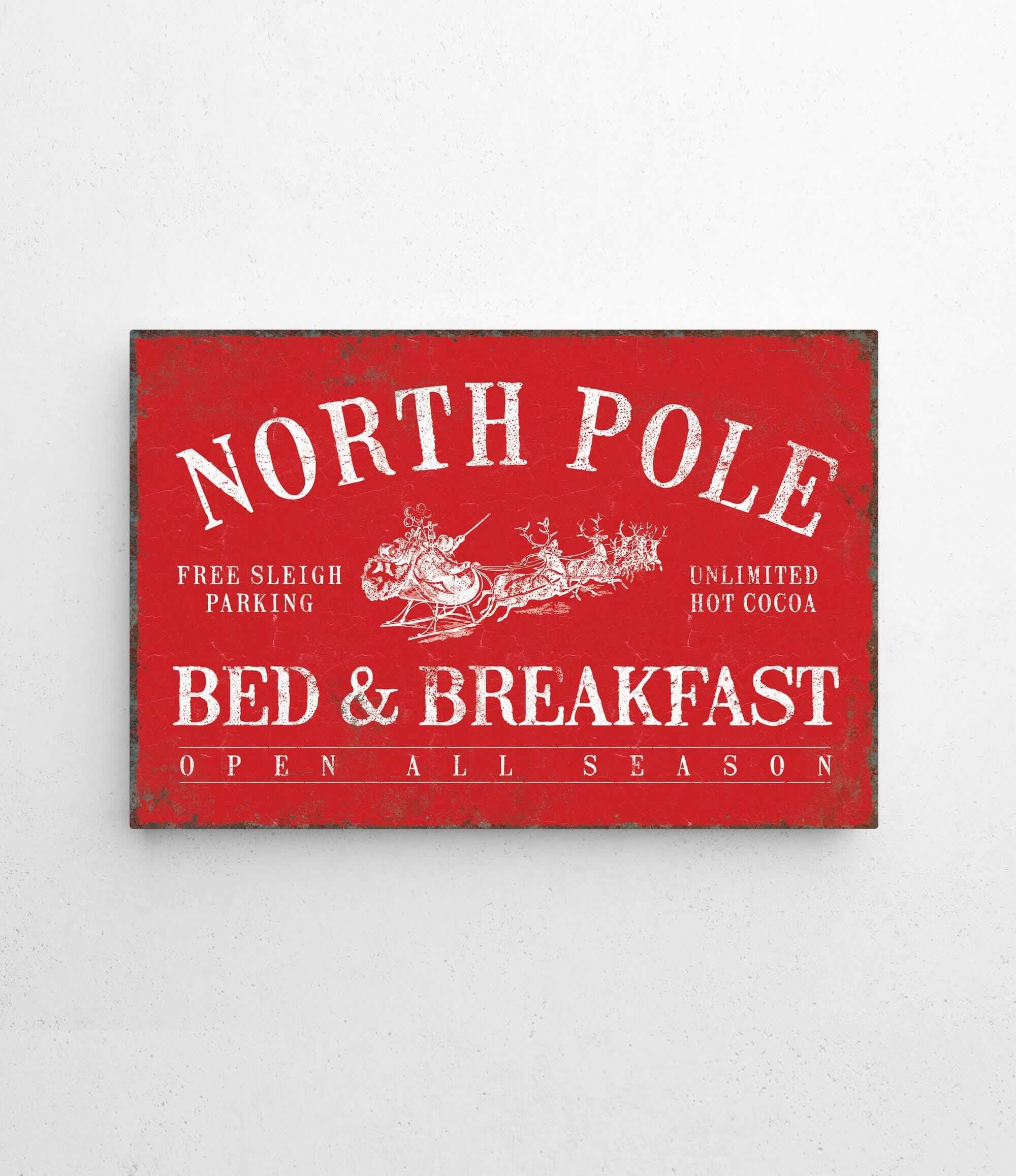 a red sign that says north pole bed and breakfast