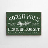 a sign on a wall that says north pole bed and breakfast