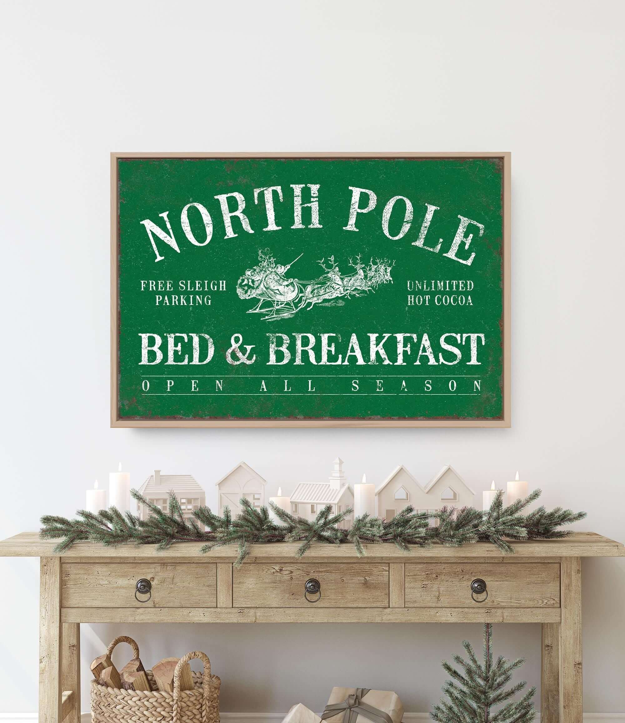 a christmas scene with a bed and breakfast sign