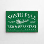 a green sign that says north pole bed and breakfast