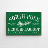 a green sign that says north pole bed and breakfast