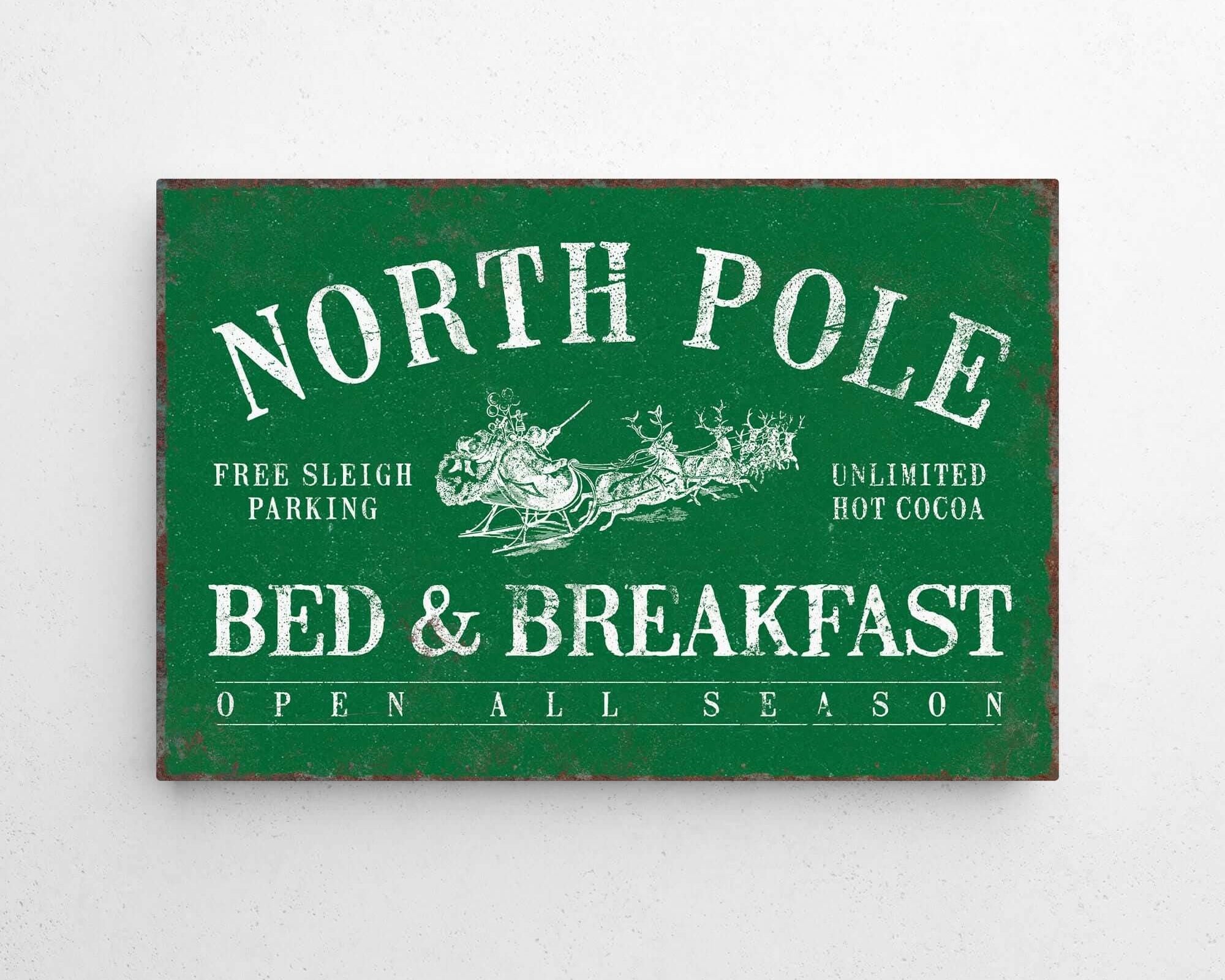 a green sign that says north pole bed and breakfast