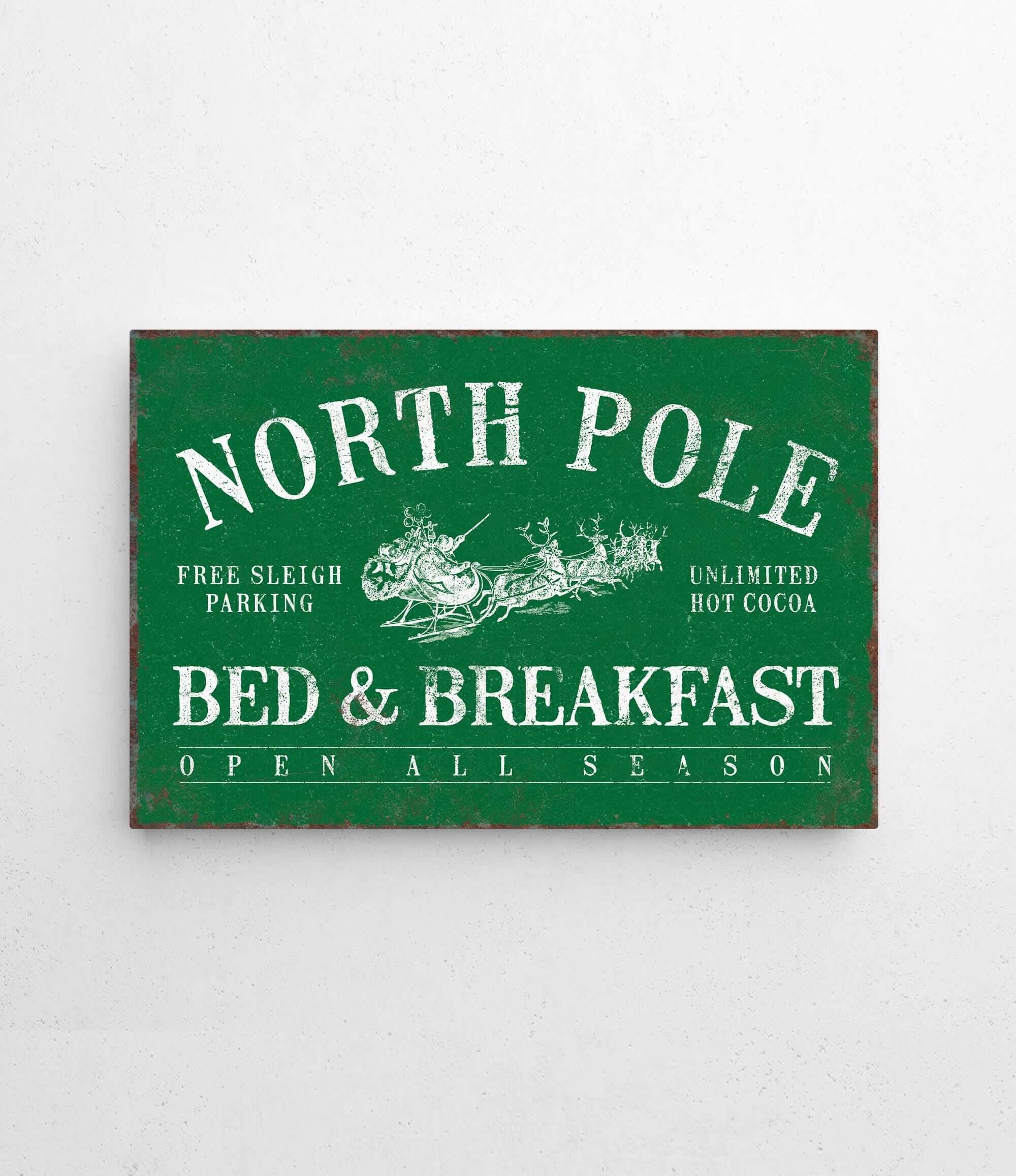 a green sign that says north pole bed and breakfast