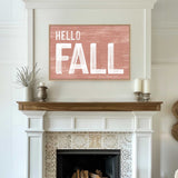 a fireplace with a hello fall sign above it