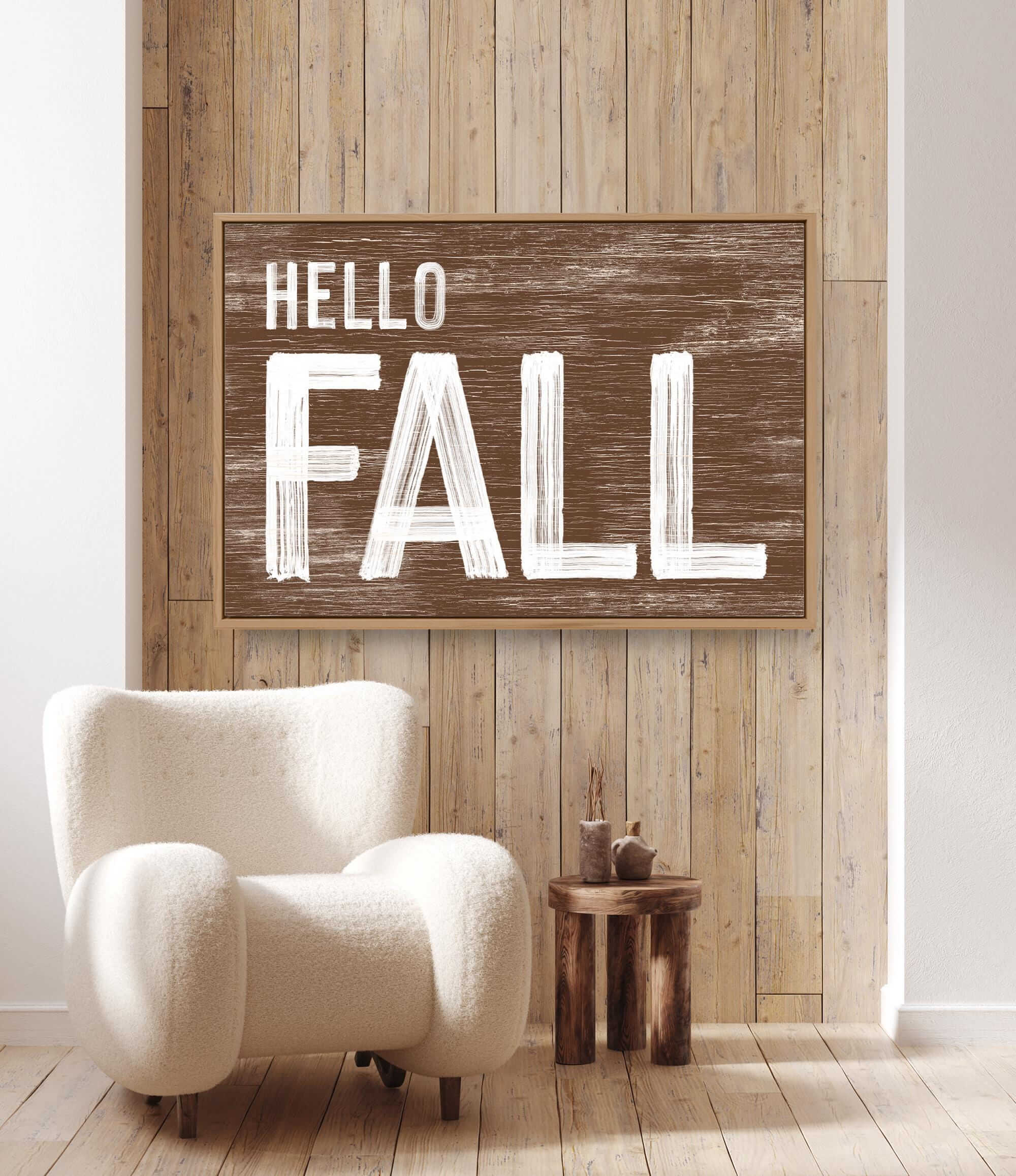 a white chair sitting in front of a wooden wall