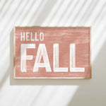 a wooden sign that says hello fall