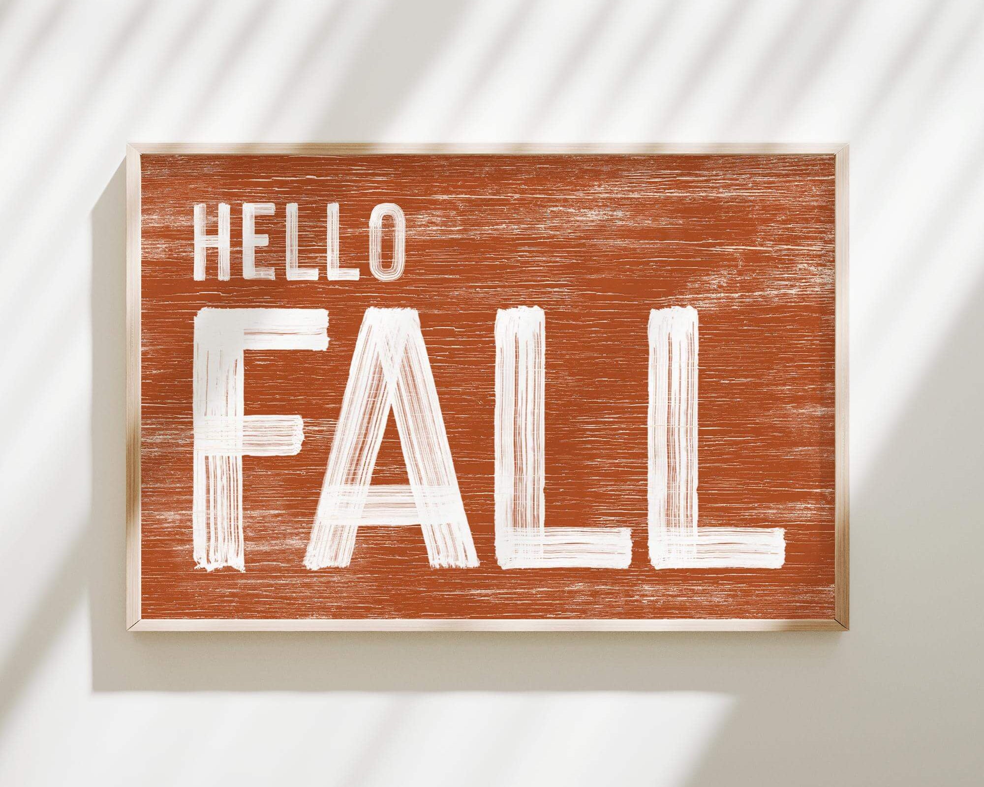 a wooden sign that says hello fall
