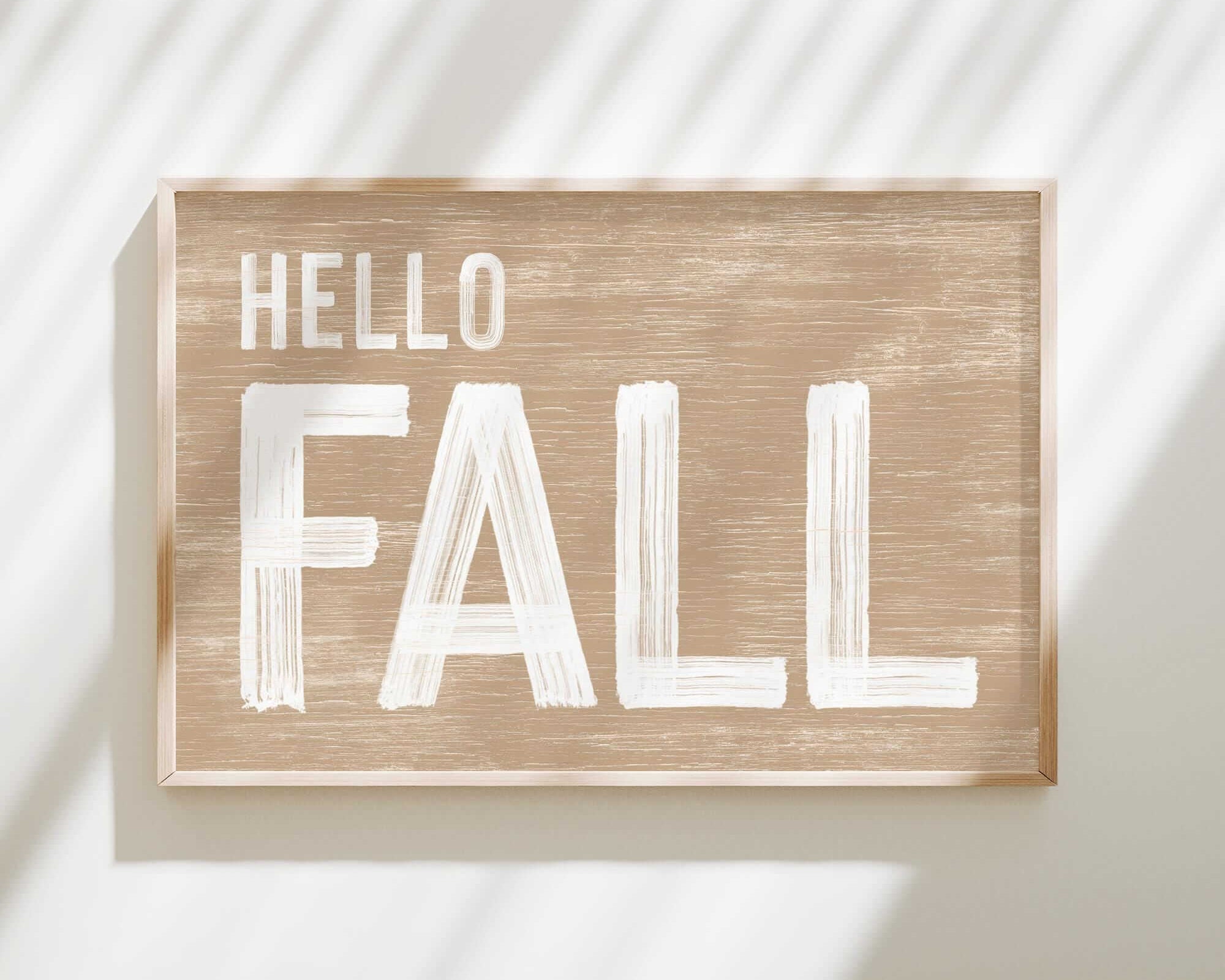 a wooden sign that says hello fall