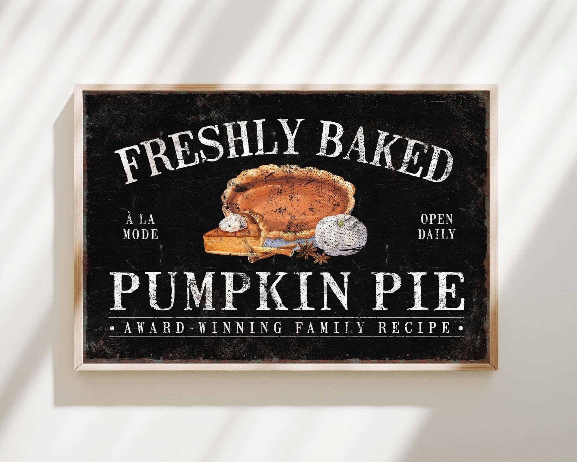a sign on a wall advertising fresh baked pumpkin pie