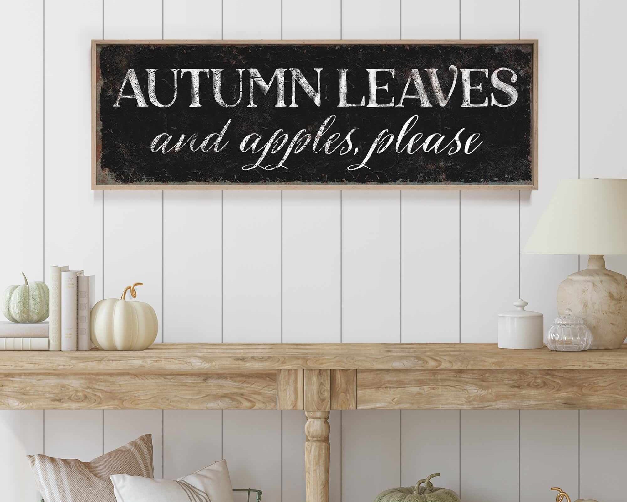a wooden sign that says autumn leaves and apples please