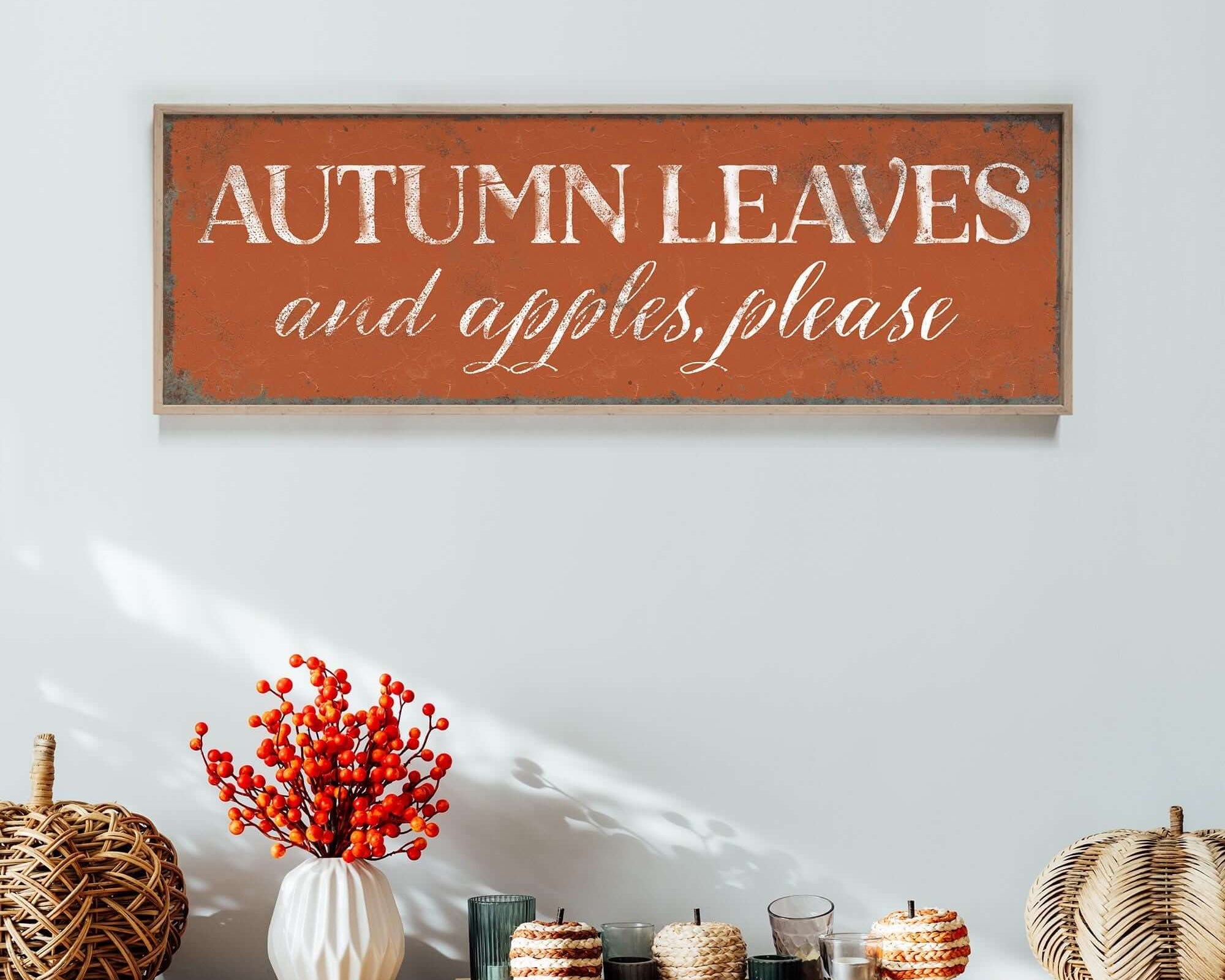 a wooden sign that says autumn leaves and apples please