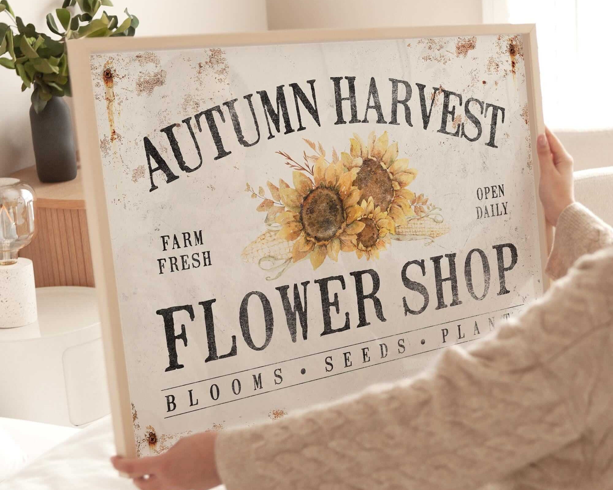 a woman sitting on a bed holding a sign