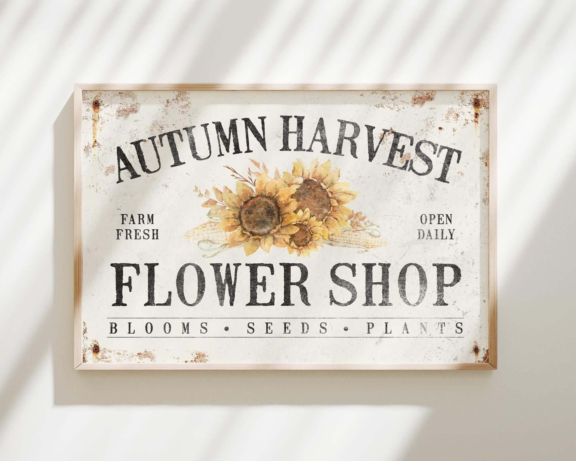 a sign on a wall that says autumn harvest flower shop
