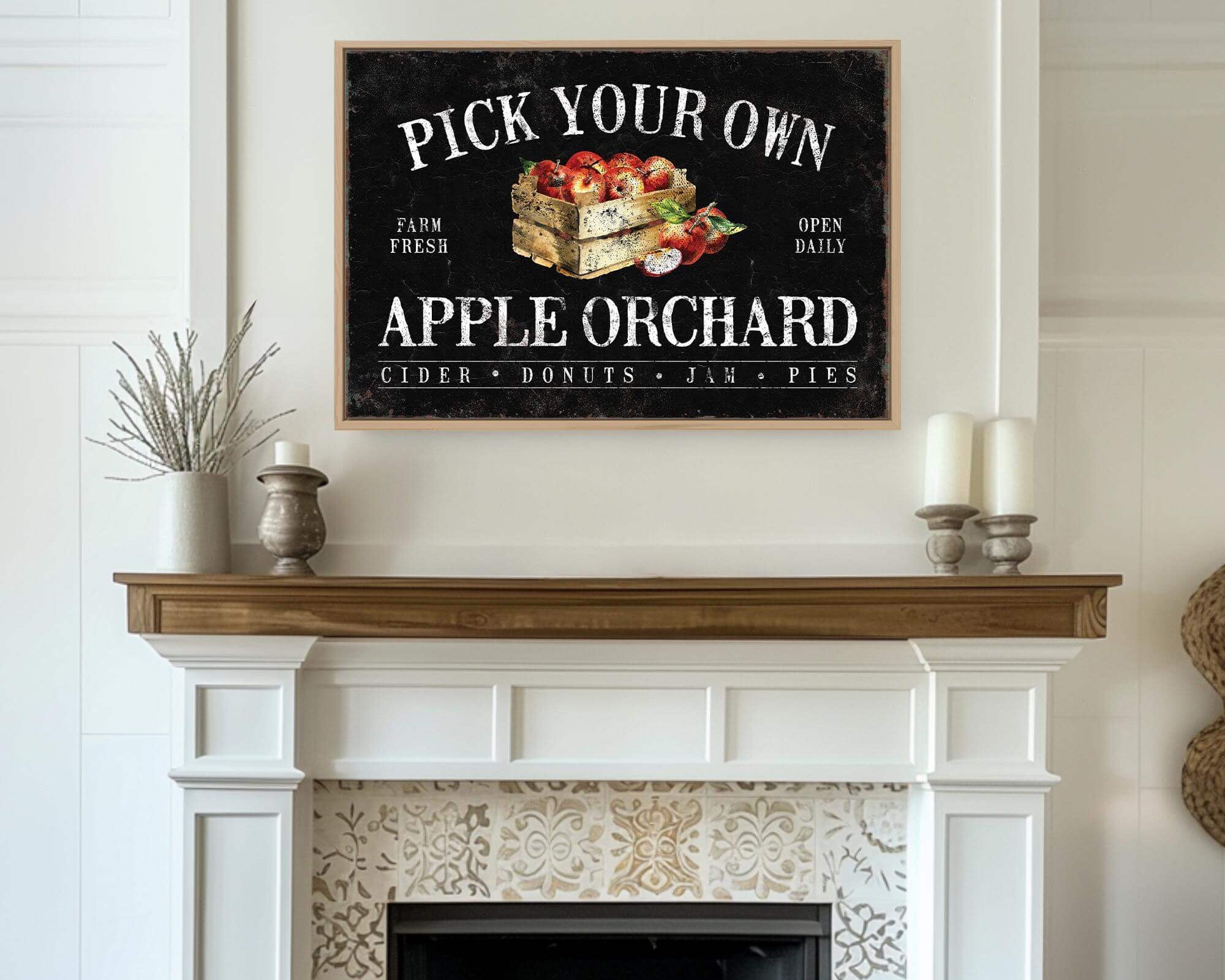 a fireplace with a sign above it that says pick your own apple orchard