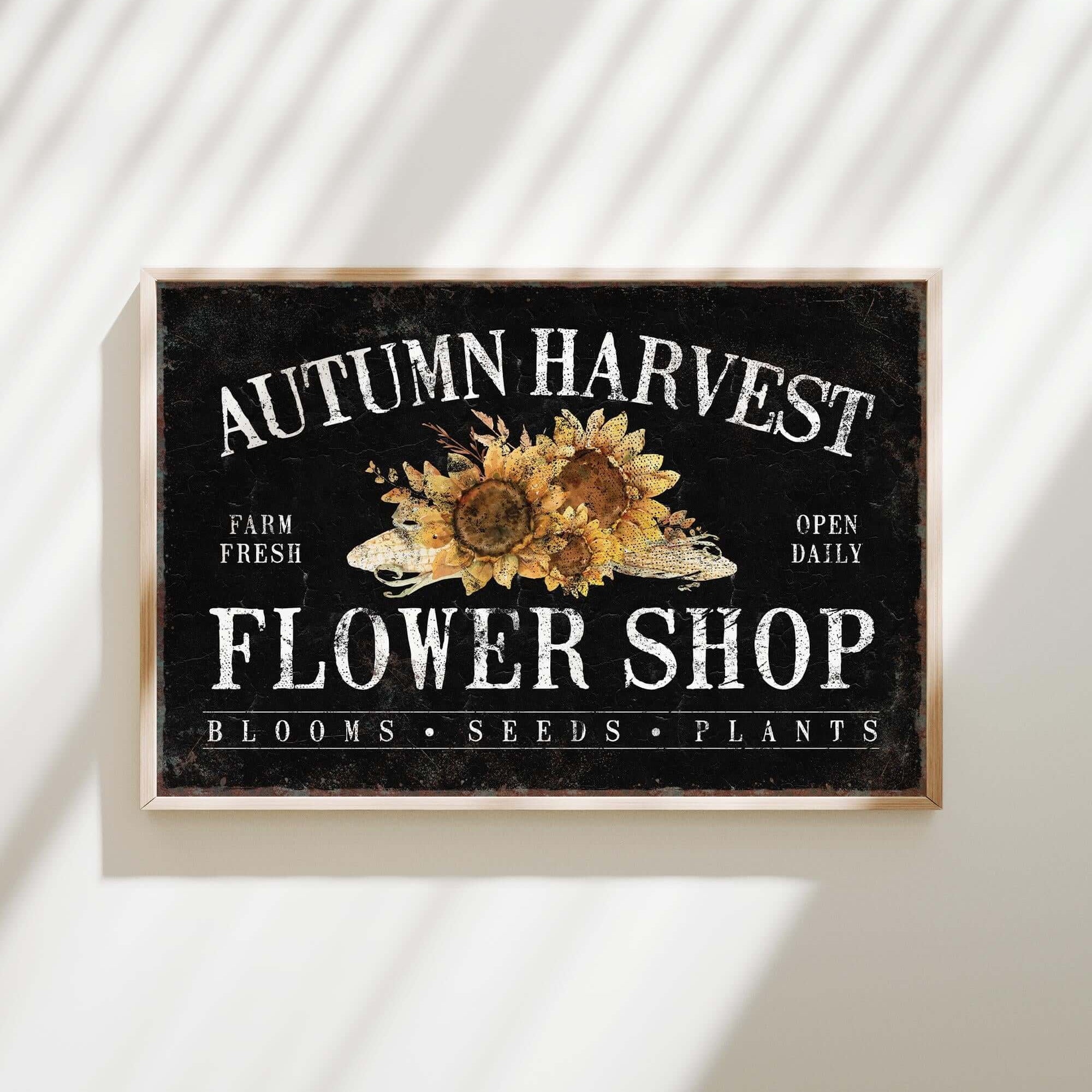 a sign on a wall that says autumn harvest flower shop