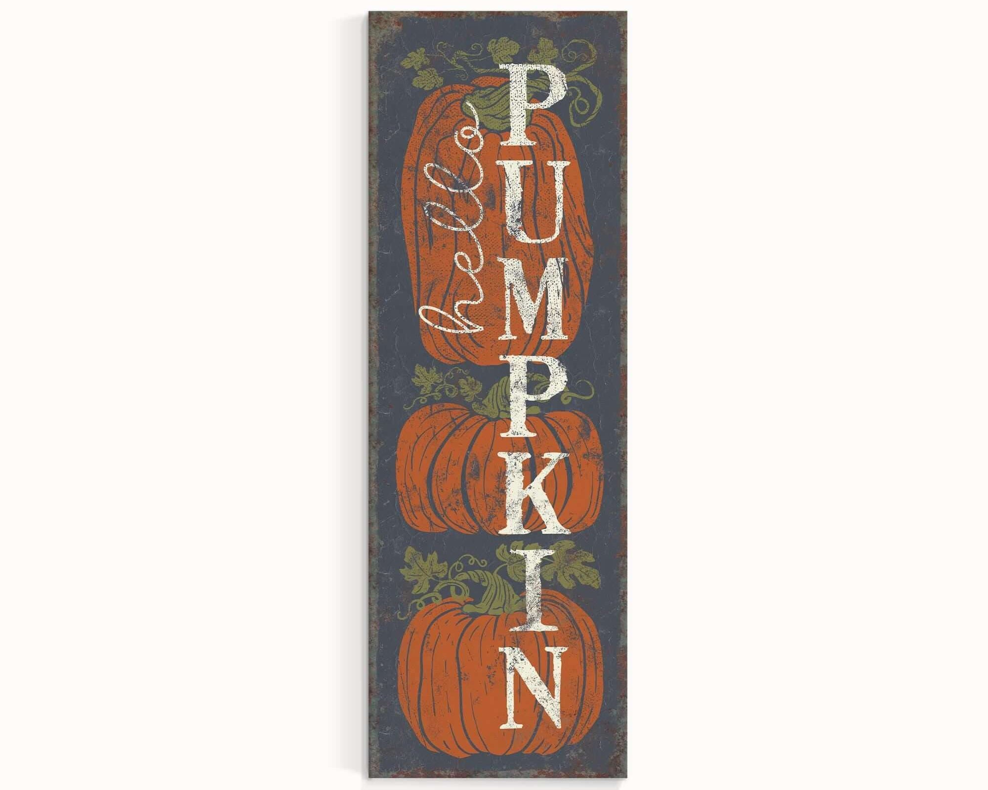 a wooden sign with pumpkins on it