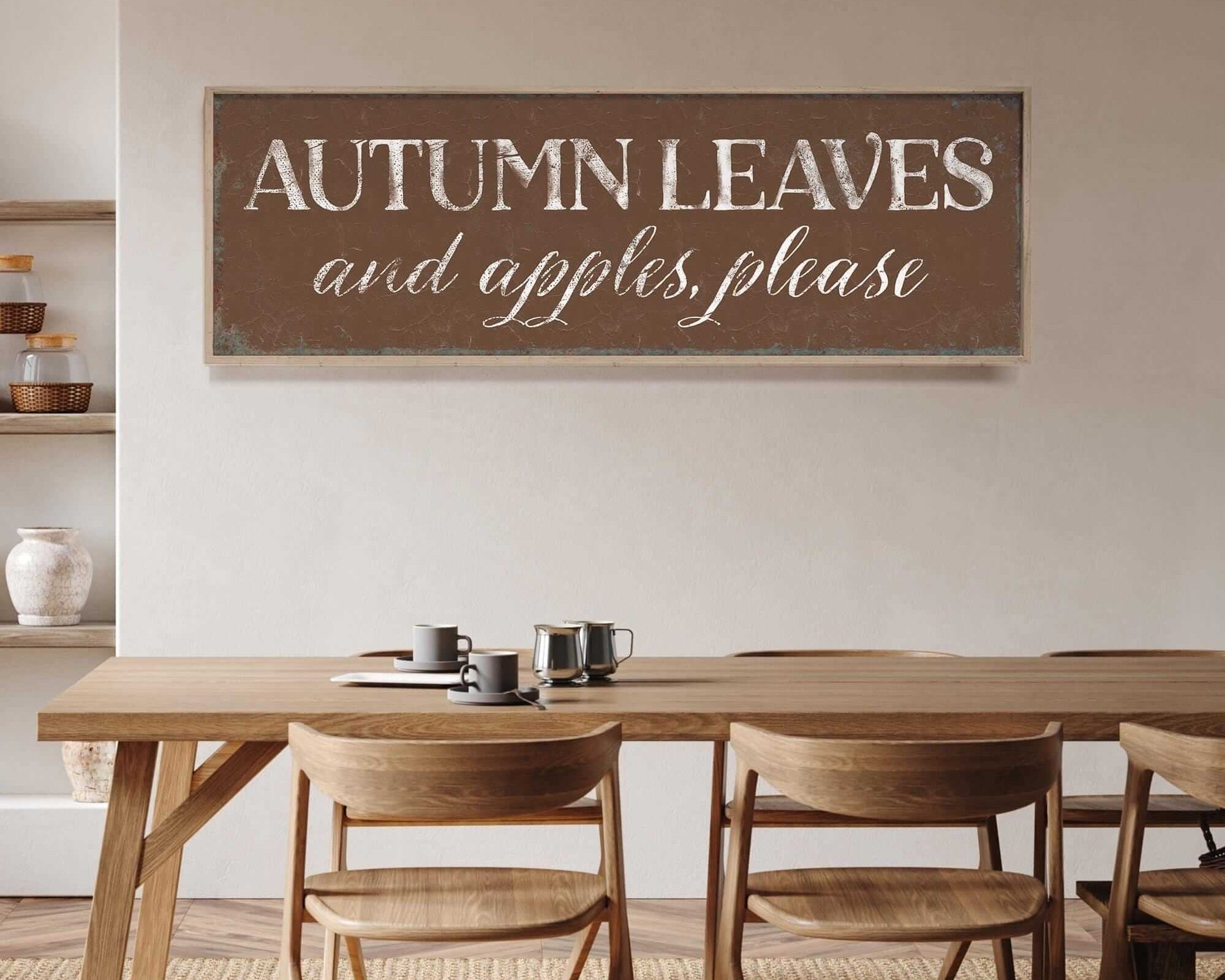 a dining room table with chairs and a sign on the wall
