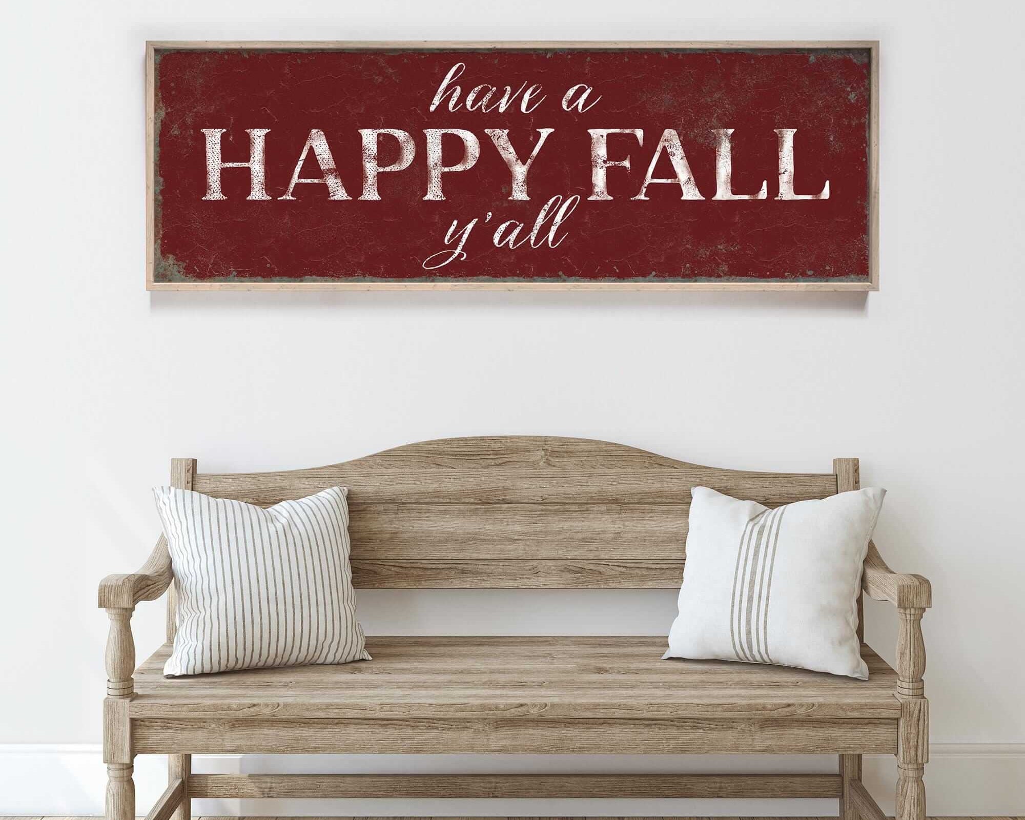 a wooden bench sitting in front of a white wall