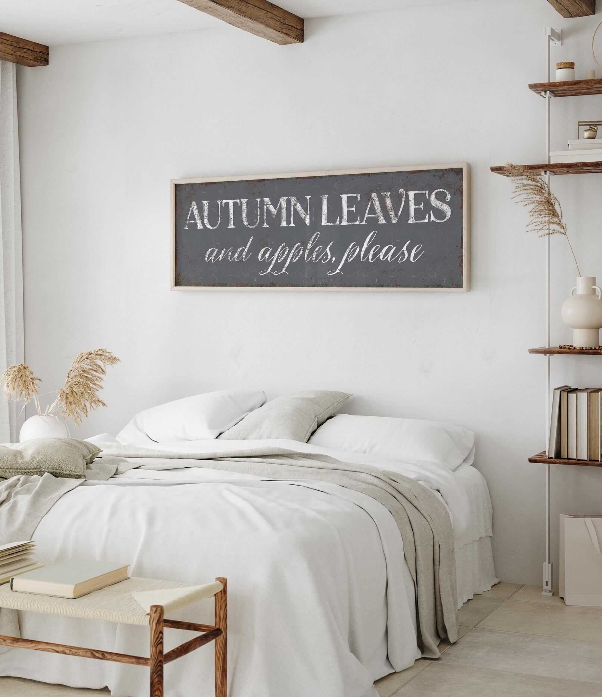 a bedroom with a white bed and a wooden sign above it