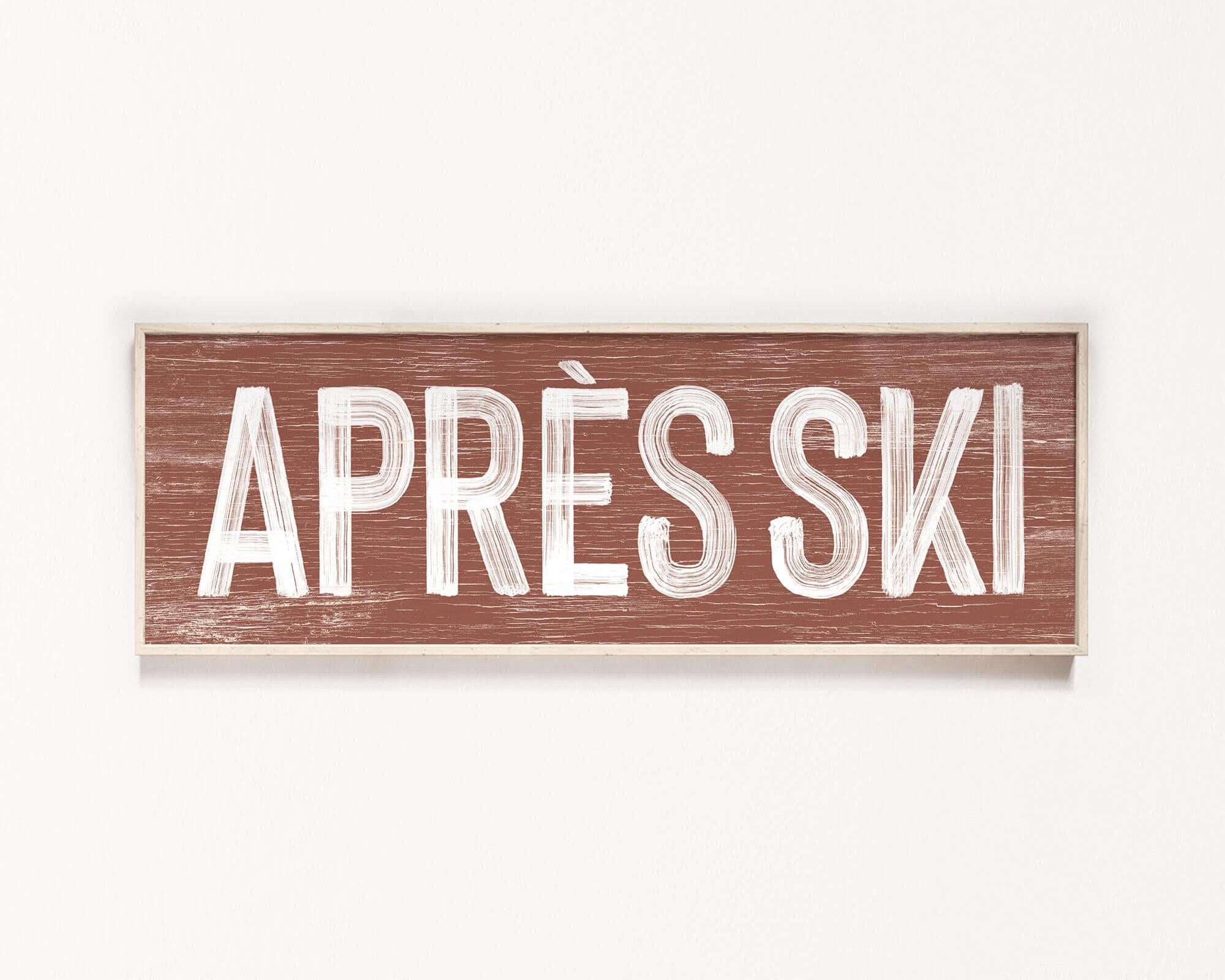 a sign that says apres ski on a white wall