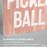a wooden sign that says pickle ball on it